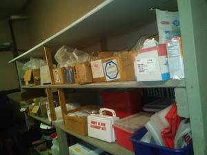 lot 1129 image: Contents of 2 shelves- janitorial and maintenance. Sharps containers and more.