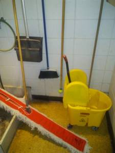 lot 1545 image: Janitorial Closet Contents  Rubbermaid brooms and more.