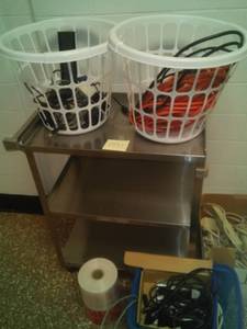 lot 1551 image: Stainless Roller cart plus power strips and more.