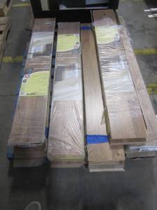 lot 97 image: Entire Pallet - Trafficmaster Ember Oak 7 mm Thick x 7 to 23 in. Wide x 50 to 45 in. Length Laminate Flooring (24.24 sq. ft.  case) 45669