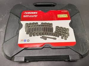 lot 14 image: HUSKY 12 in. Drive SAEMetric Impact Socket Set (64-Piece) - RETAIL $199