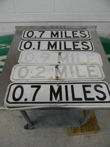 lot 24 image: BOX OF MILES AHEAD ROAD SIGNS - SEE PICTURES