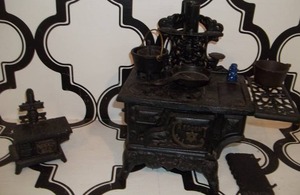 lot 130 image: Toy Cast Iron Stoves