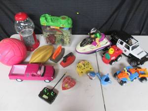 lot 18 image: Vintage Toy Irons, Working Gumball Machine, Jet Skii, (Remote is for Wall E RC in Lot #17), Rescue Rangers ATV, Toy Solders