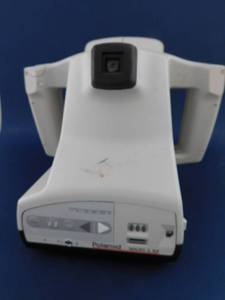 lot 14 image: Polariod Macro 5 SLR Camera