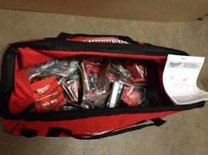 lot 13 image: M18 18-Volt Lithium-Ion Cordless Combo Tool Kit (4-Tool) w(2) 3.0Ah Batteries, (1) Charger, (1) Tool Bag good condition