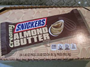 lot 141 image: Box of 24 Snickers Creamy Almond Bu...