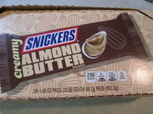lot 143 image: Box of 24 Snickers Creamy Almond Bu...