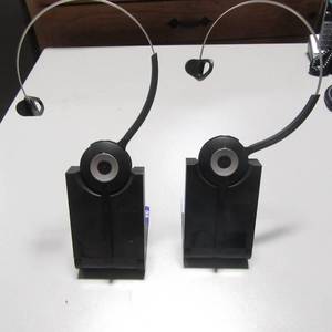 lot 42 image: Lot of 2 Jamba Wireless headsets with charging stands WHB003BS