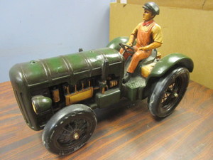 lot 721 image: VINTAGE CARVED-WOOD MAN ON TRACTOR