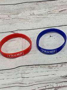 lot 59 image: Pair of Glow in the Dark Donald Trump Bracelets