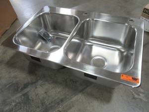 lot 254 image: Elkay 33 X 22 X 9 Stainless Steel Double-Basin Drop-in 2-Hole Kitchen Sink - Corner Slightly Bent