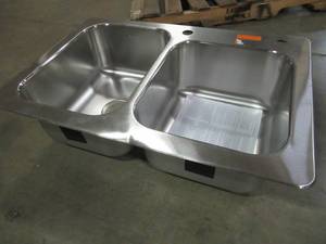 lot 265 image: Elkay 33 X 22 X 9 Stainless Steel Double-Basin Drop-in 2-Hole Kitchen Sink - Front Lip Slightly Bent.