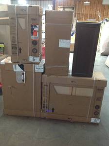 lot 12 image: Pallet with assorted  Hampton Bay kitchen and wall Cabinets  diferent styles  sizes and colors