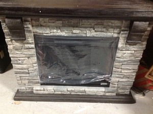 lot 109 image: Home Decorators Collection Highland 50 in. Faux Stone Mantel Electric Fireplace in Gray whit damage on the back side please review the pictures