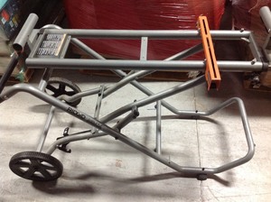 lot 104 image: RIDGID Universal Mobile Miter Saw Stand in good conditions missing one Universal mounting brackets