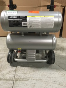 lot 200E102 image: Husky 4.5 Gal. Portable Electric-Powered Silent Air Compressor IN WORKING CONDITIONS