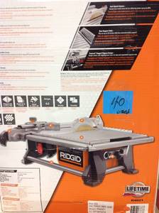 lot 40 image: Ridgid 6.5 Amp Corded 7 in. Table Top Wet Tile Saw USED in good condition