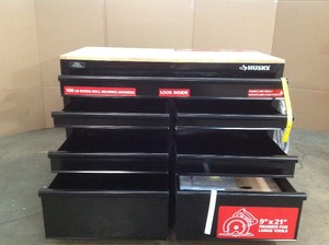 lot D107 image: Husky 46 in. W x 24.5 in. D 9-Drawer Mobile Workbench with Solid Wood Top in All Black Finish whit small damage please review the pictures