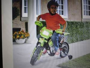 lot 66 image: Green Motorcycle open box Retail $1...