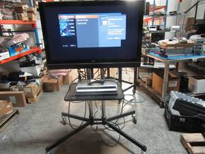 lot 79 image: 42 in LG TV with DVDDVD Recorder on Rolling cart with stand, remote