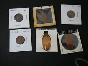 lot 141 image: 901 Ancient CoinWheat Penny 3 Elongated Pennies 1- Lords Prayer 1- Ten Commandments 1- 25th Anniversary sinking By Japanese USS Chicago