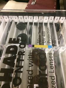 lot 29 image: Lot Of New Clip On Polaroid Sunglasses In Display Case