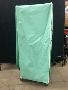 lot 102 image: MSRP $500 Hospital Grade Multi-purpose Mckesson Utility Cart With Shelves & Zippered Cover MODEL VL MPC400 - Excellent Condition 3 twin-wheel casters 29 X 69 X 20