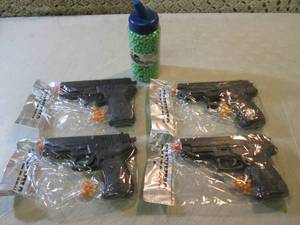 4 Pistol Airsoft Guns and Bottle of...