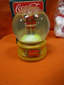 lot 229 image: Coca Cola Dancing Santa, Bubble Blowing Bear, Snow Globe, Book