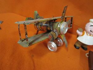 lot 388 image: Pig Figurines, Cookie Jar, Beer Can Plane