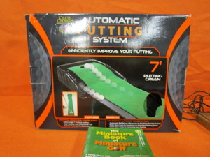 lot 418 image: Auto Putting System, Mini Golf BookGame, Horse Lamp, Suitcases
