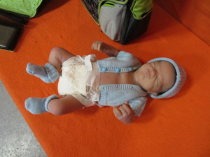lot 411 image: Anatomy Correct Real Doll, Diaper Bag, Changing Pad
