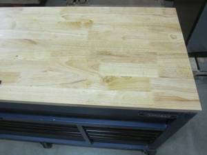 lot 145 image: Husky 72 in. 18-Drawer Mobile Workbench with Adjustable-Height Solid Wood Top in Matte Blue HOLC7218BL1M