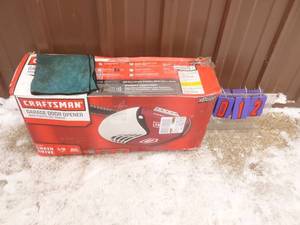 Craftsman 12 hp garage door opener. Looks new in box. Is adaptable to smart control. As shown.
