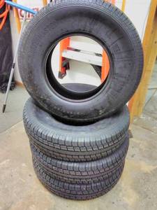 lot 132 image: Lot of (4) Rubbermaster RM77  ST23585R16 125121L Trailer Tires