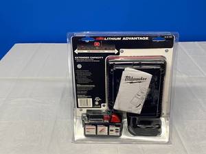 lot 4 image: MILWAUKEE M18 EVERYTHING FITS BATERY AND CHARGER