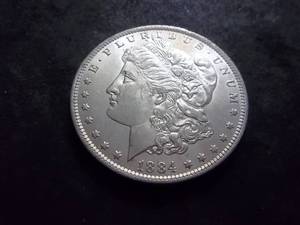 lot 14 image: 1884 O Morgan Silver Dollar