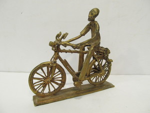 lot 65 image: Vintage Heavy Brass Man on Bicycle Sculpture