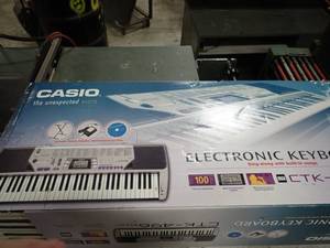 lot 134 image: CASIO Electric Keyboard,  missing cords (available to buy)