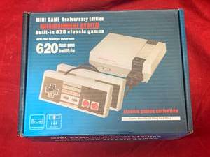 lot 28 image: Mini Entertainment Game System with 620 Games