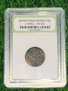 lot 101 image: Ancient Greek Bronze Coin c 400bc-300ad
