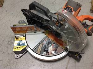 RIDGID 15 Amp Corded 12 in. Dual Bevel Miter Saw with Adjustable Laser Guide, Carbide Tipped Blade, and Dust Bag in good condition