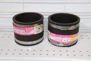 lot 117 image: (2) 4 Rubber Couplers