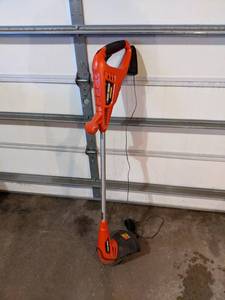 lot 44 image: Black & Decker Cordless Weed Whacker with Charger