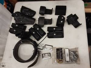 lot 41 image: 2-Holsters, 3-Can Holders, Speed Loader Holder, 3-Double Mag Pouches, Bag Of Keepers, 4-Belt Keepers, 1-Well Used Duty Belt With Holster Sz. 48