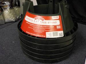 lot 37 image: 5 xmas Tree Stands retail $14.98 e...