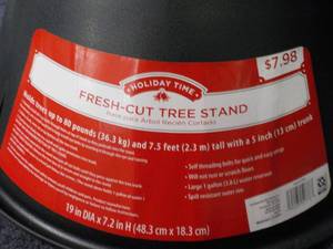 lot 38 image: 12 Xmas Tree Stands retail $7.98 e...