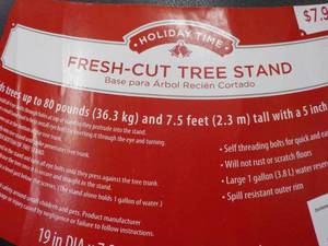 lot 39 image: 12 Xmas Tree Stands retail $7.98 e...