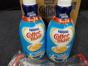 lot 203 image: 2 - 50 oz Bottles Nestle Coffee Mat...